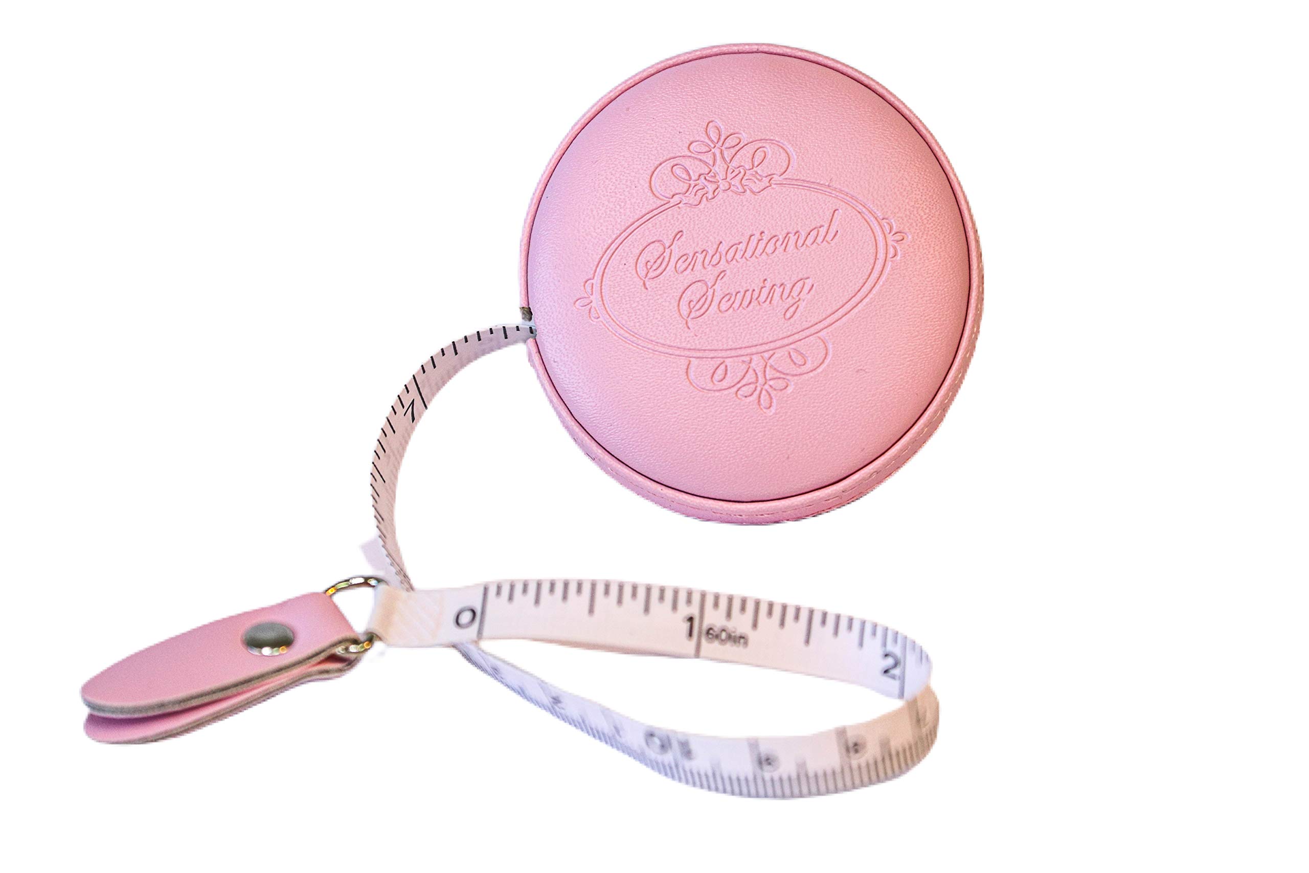 Premium Photo  Measuring tape with centimeters and inches on pink  background.