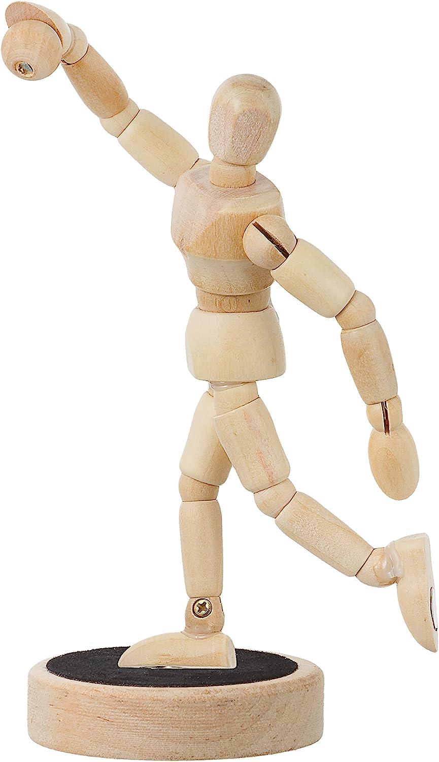 A Wooden Mannequin In A Sitting Position Stock Photo, Picture and Royalty  Free Image. Image 88905469.